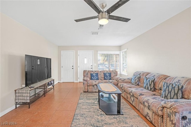 living room with light tile patterned floors and ceiling fan