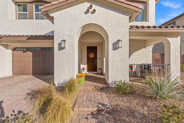 doorway to property featuring a garage