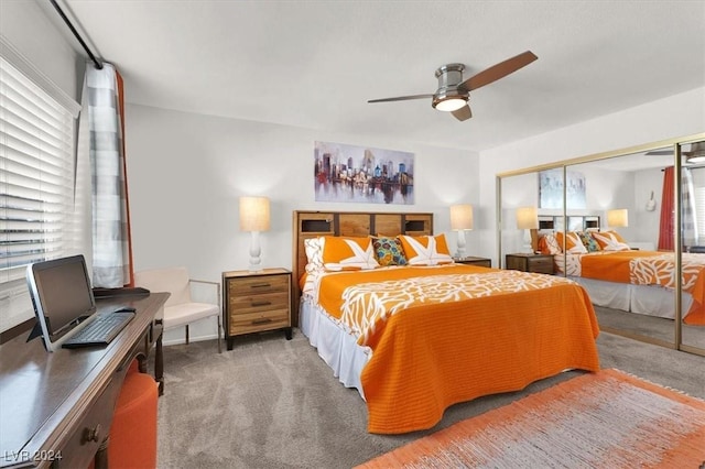 bedroom with ceiling fan, a closet, and carpet