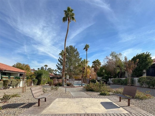 surrounding community featuring a patio and a swimming pool