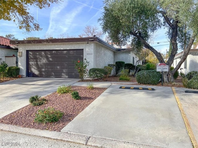 ranch-style house featuring a garage