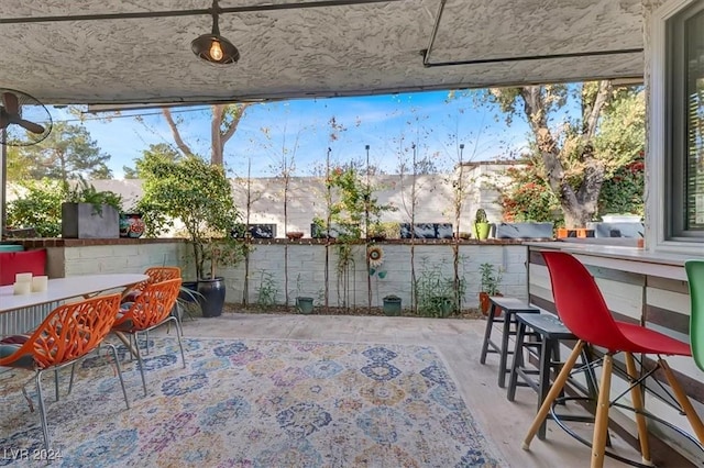 view of patio / terrace featuring an outdoor bar