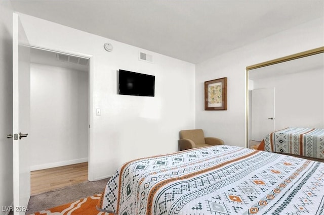 bedroom featuring a closet and wood-type flooring