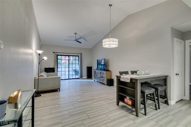 interior space with ceiling fan, light hardwood / wood-style floors, and vaulted ceiling