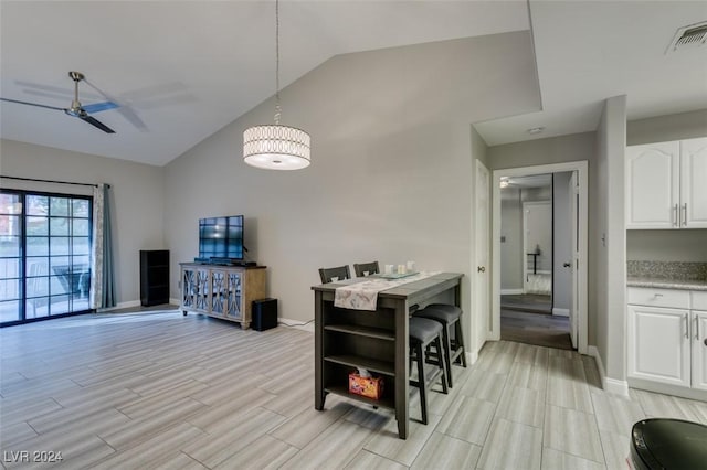 interior space with ceiling fan, light hardwood / wood-style floors, and lofted ceiling