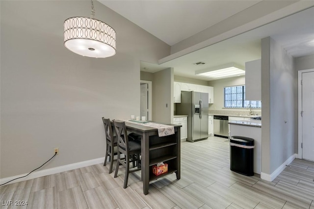 dining space featuring light hardwood / wood-style flooring