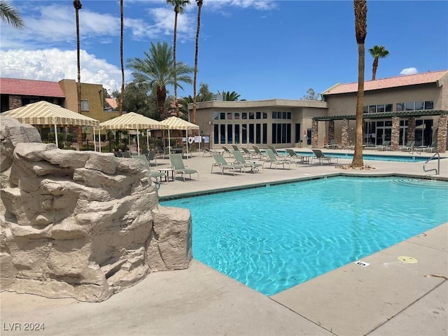 view of swimming pool with a patio area