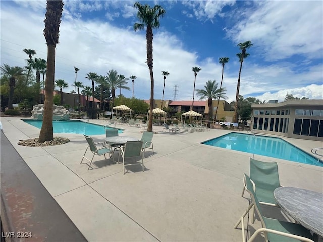 view of swimming pool featuring a patio