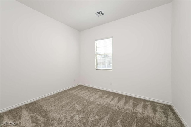 spare room featuring carpet flooring