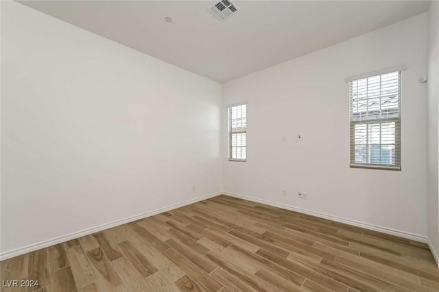 spare room featuring light wood-type flooring