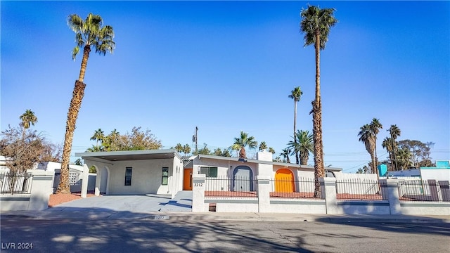 view of front facade with a carport