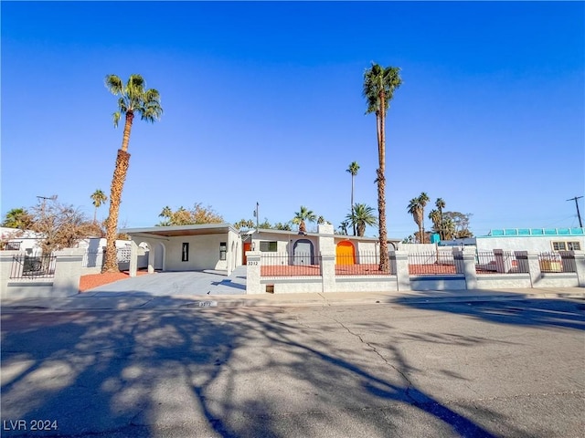 single story home featuring a carport