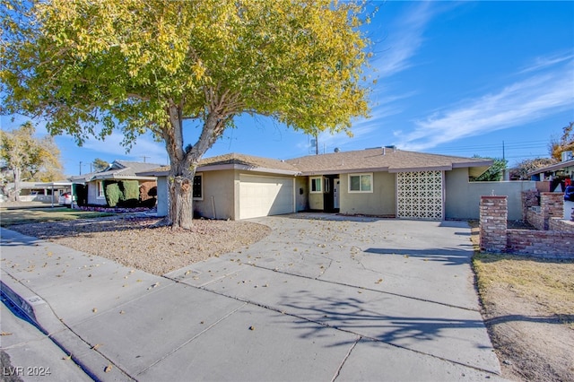 single story home featuring a garage