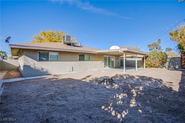 rear view of house featuring a patio and central air condition unit