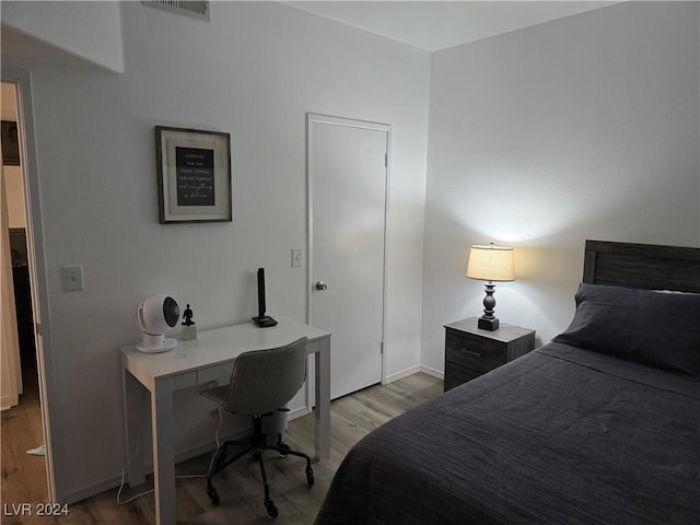 bedroom featuring light hardwood / wood-style floors