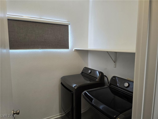 laundry room with independent washer and dryer