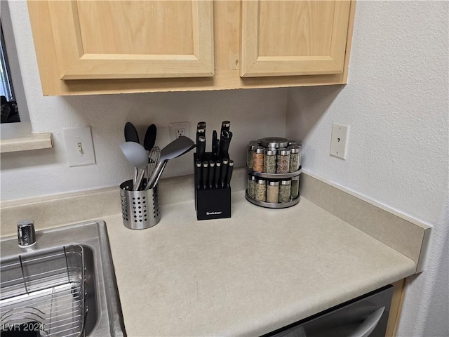 details featuring light brown cabinetry