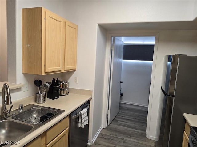 kitchen featuring sink, light brown cabinets, black dishwasher, dark hardwood / wood-style floors, and stainless steel refrigerator