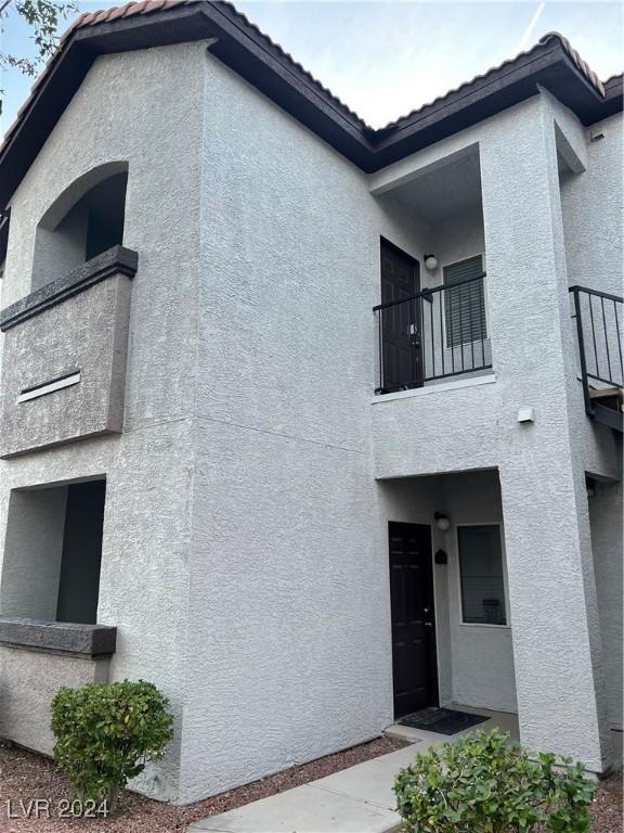 view of home's exterior with a balcony