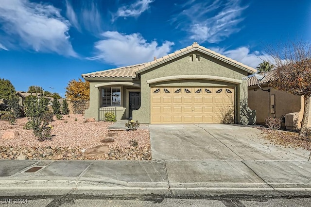 view of front of property featuring a garage