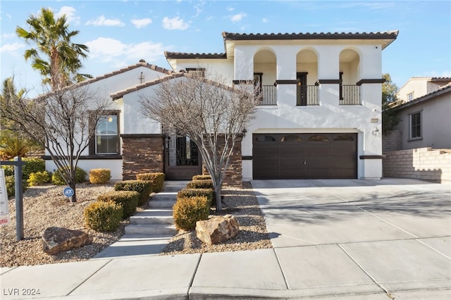 mediterranean / spanish-style house featuring a garage