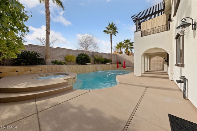 view of swimming pool with a patio and an in ground hot tub