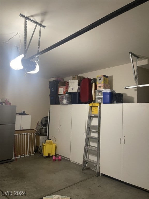 garage with stainless steel refrigerator