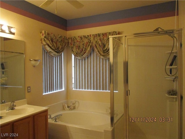 bathroom featuring vanity, separate shower and tub, and ceiling fan