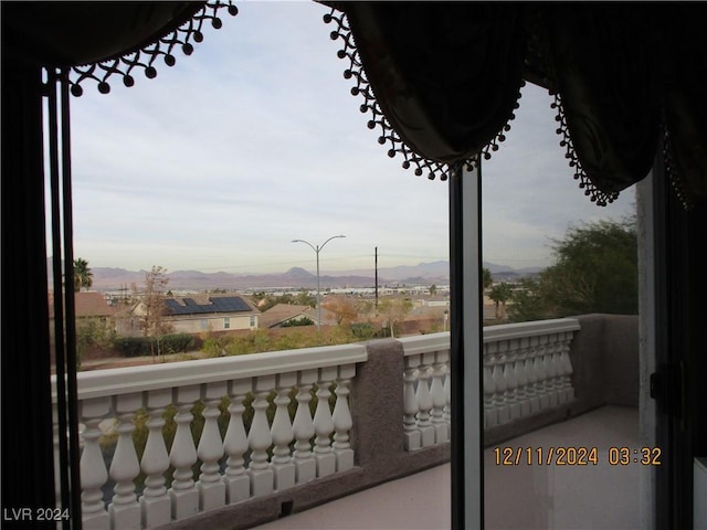 balcony featuring a mountain view