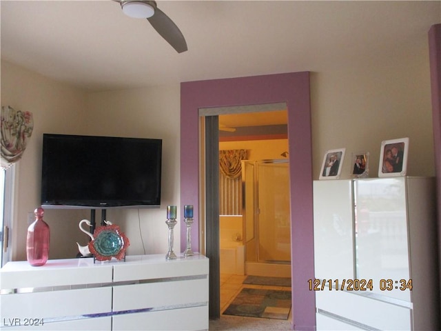 bedroom with ensuite bathroom and ceiling fan