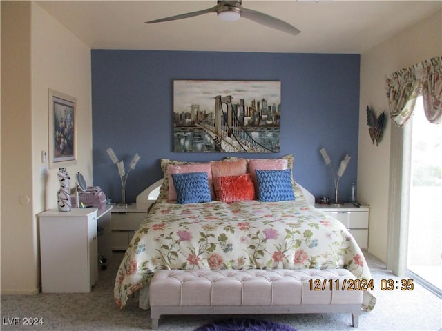 bedroom with ceiling fan and carpet floors