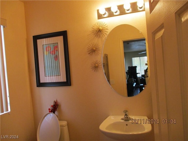 bathroom with toilet and sink