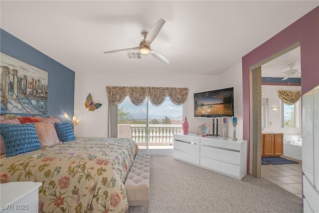 bedroom with access to outside, a ceiling fan, carpet, and ensuite bath