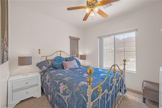 bedroom featuring carpet floors, baseboards, ceiling fan, and visible vents
