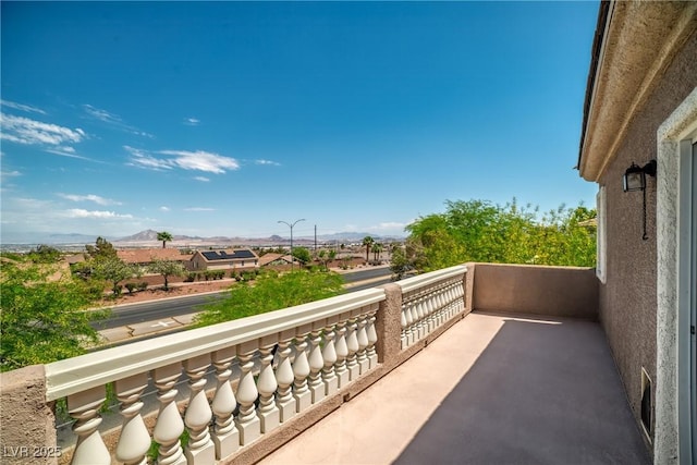 balcony featuring a mountain view