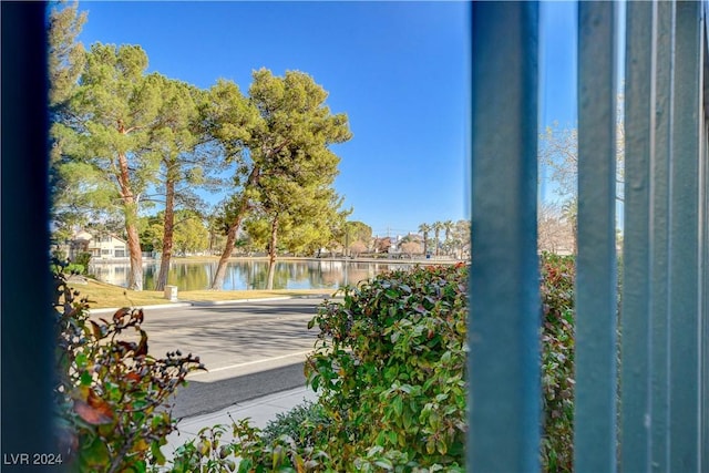 view of swimming pool featuring a water view