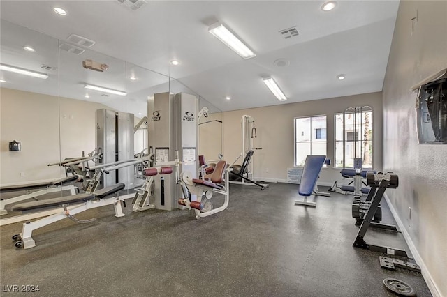 workout area with vaulted ceiling