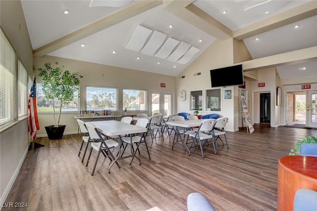 dining space featuring beamed ceiling, wood-type flooring, high vaulted ceiling, and french doors