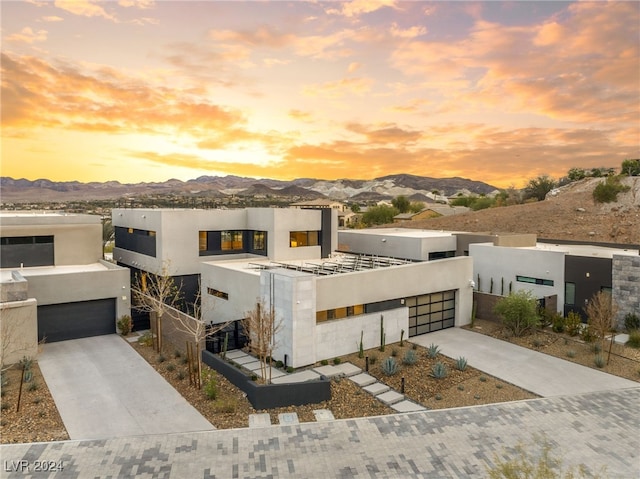 modern home featuring a mountain view and a garage