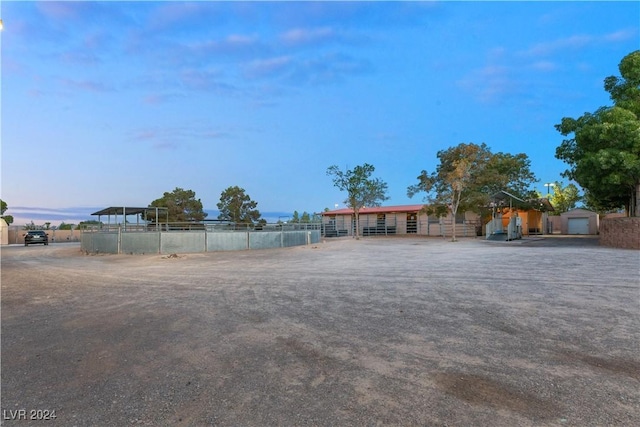 yard at dusk with an outdoor structure