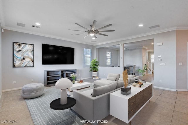 tiled living room with crown molding and ceiling fan