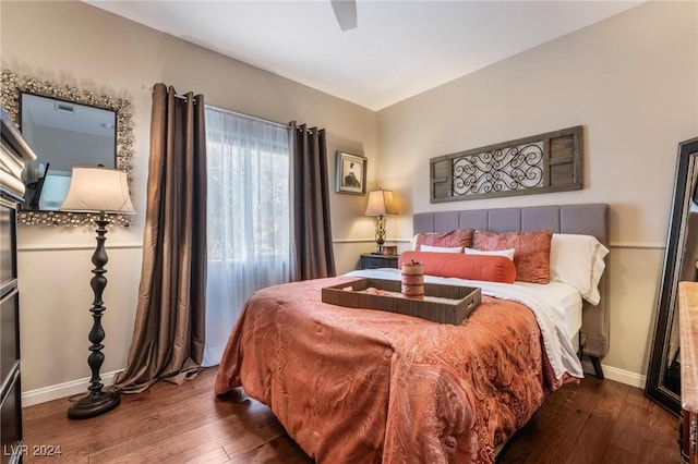 bedroom featuring ceiling fan and dark hardwood / wood-style floors