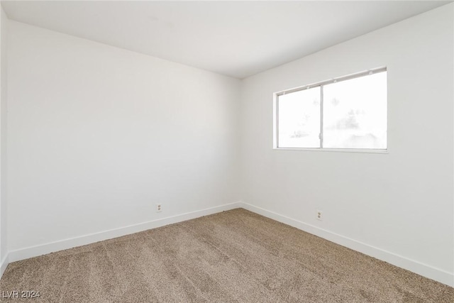 empty room featuring carpet floors