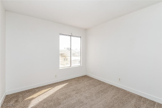 empty room with carpet flooring