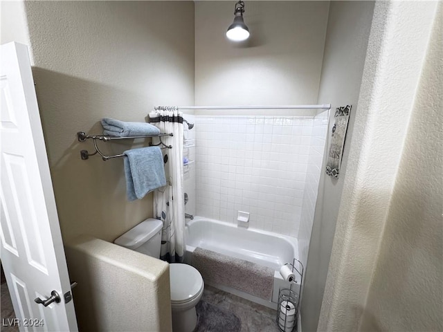 bathroom with shower / bath combo and toilet