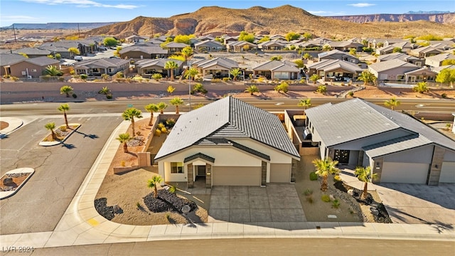 birds eye view of property featuring a mountain view