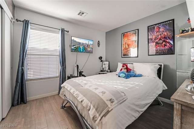 bedroom with wood-type flooring