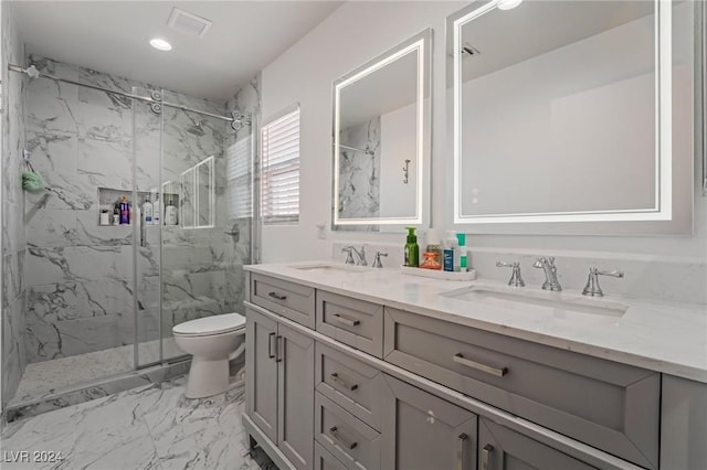 bathroom with walk in shower, vanity, and toilet