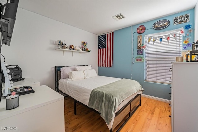 bedroom featuring hardwood / wood-style floors