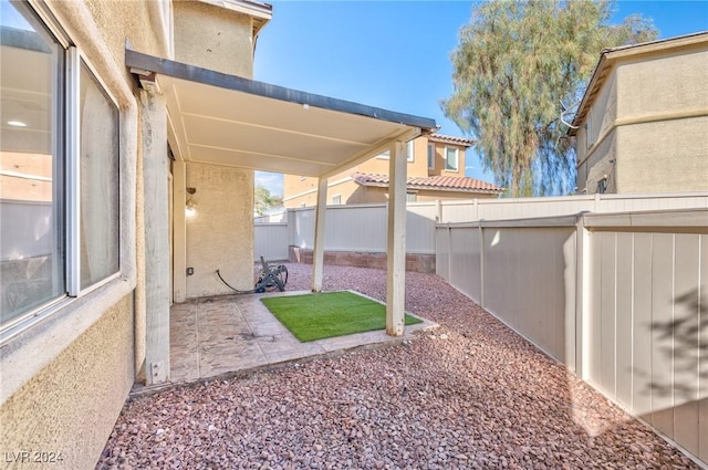 view of yard with a patio and a fenced backyard